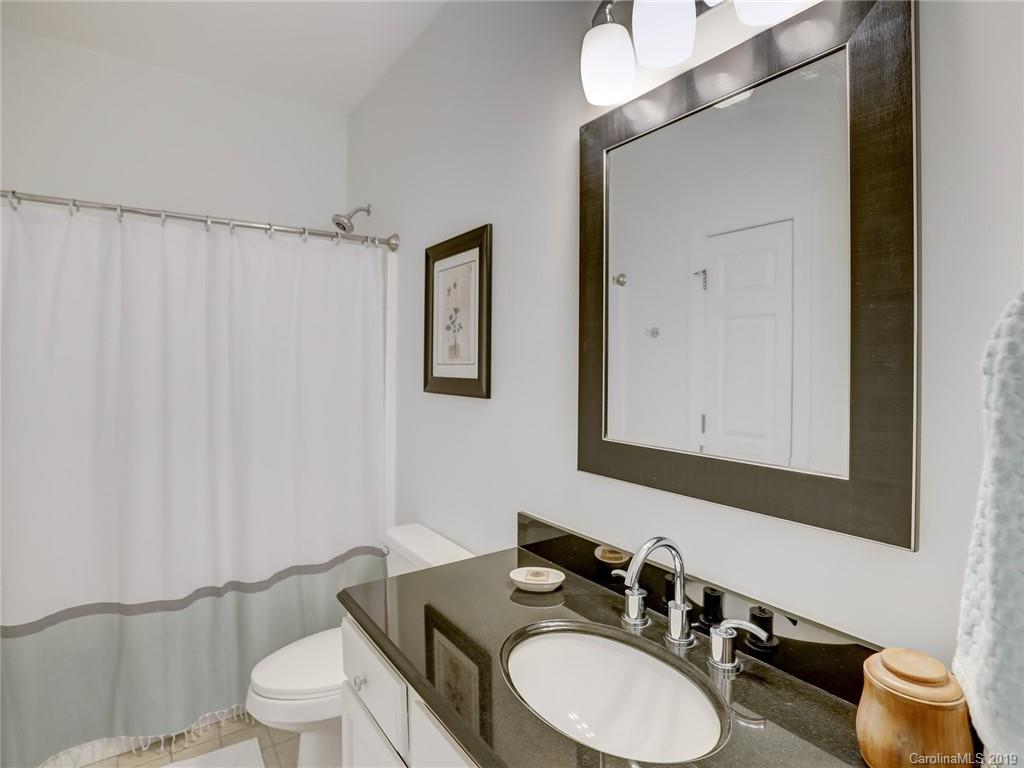 2533 Lower Assembly Drive Fort Mill, SC 29708 - Photo 34 of 48 a bathroom with a granite countertop sink mirror a toilet and a mirror