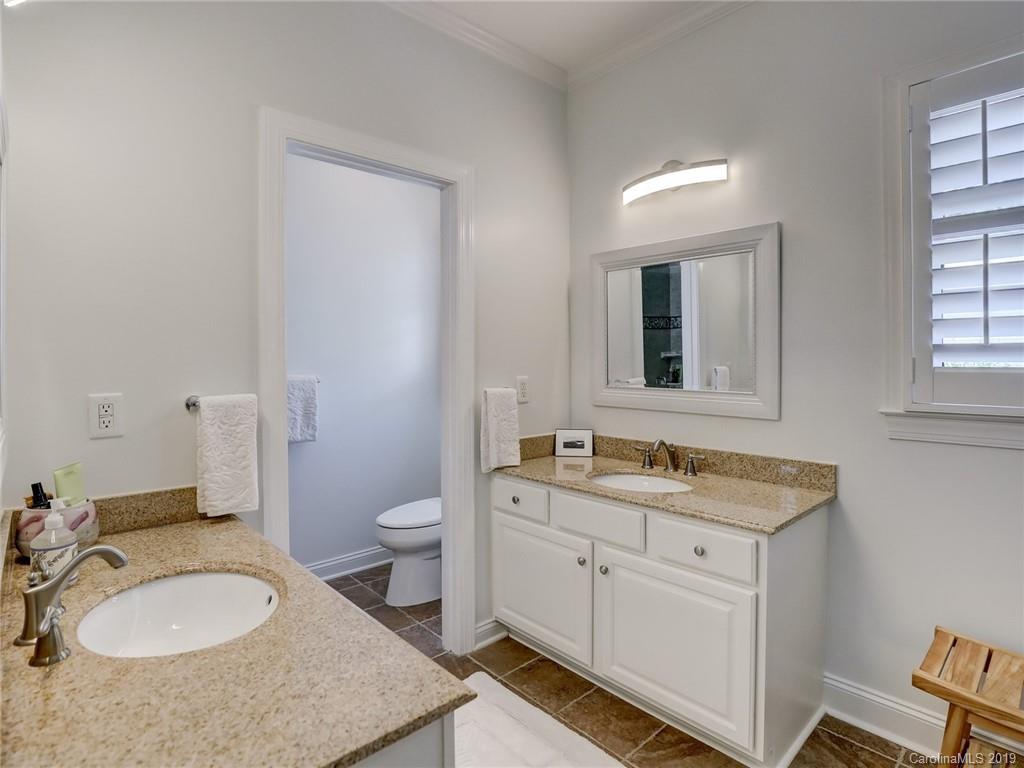 2533 Lower Assembly Drive Fort Mill, SC 29708 - Photo 37 of 48 a bathroom with a granite countertop toilet sink and mirror