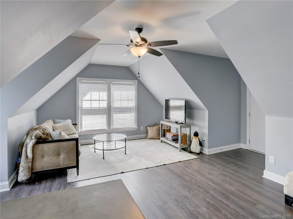 2533 Lower Assembly Drive Fort Mill, SC 29708 - Photo 41 of 48 a living room with furniture and a chandelier