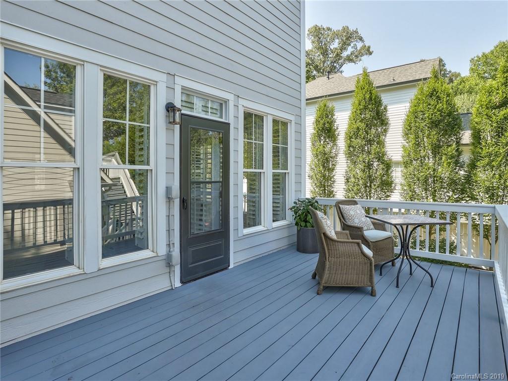 2533 Lower Assembly Drive Fort Mill, SC 29708 - Photo 46 of 48 a view of a deck with table and chairs and wooden floor