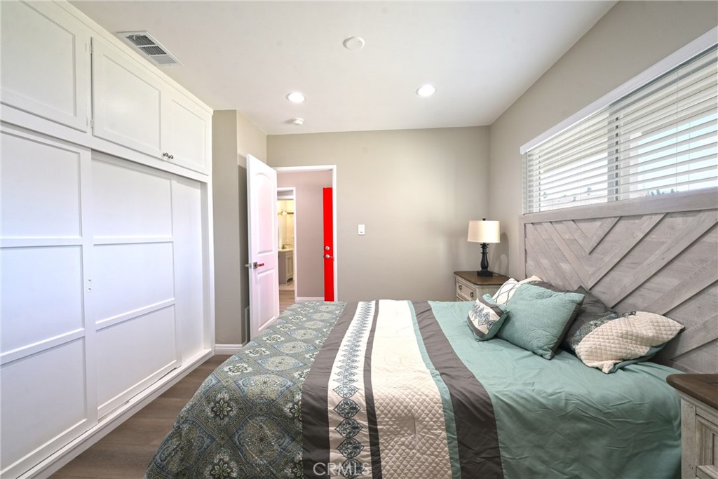 10028 Mildred Court Riverside, CA 92503 - Photo 18 of 50 a bedroom with a bed and window