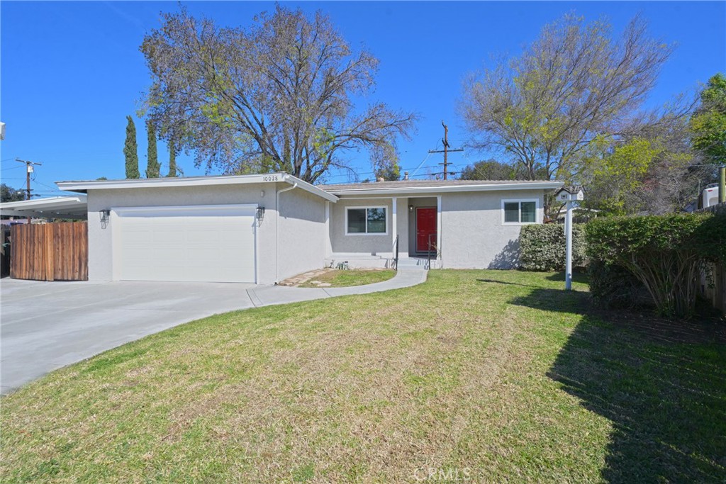 10028 Mildred Court Riverside, CA 92503 - Photo 44 of 50 a view of a house with a yard and garage