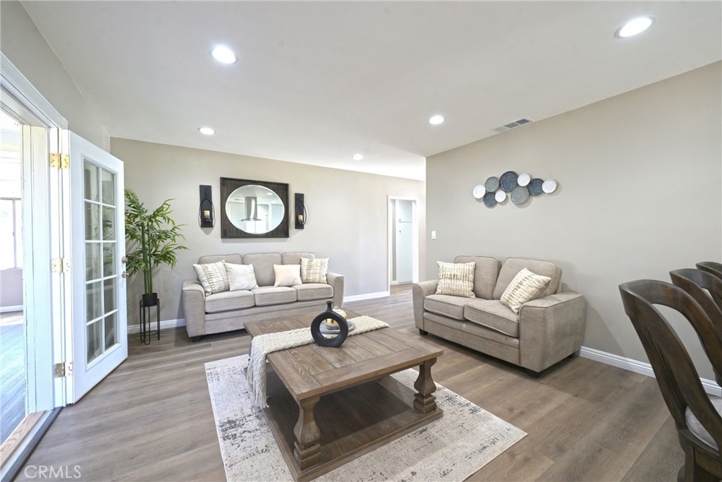10028 Mildred Court Riverside, CA 92503 - Photo 6 of 50 a living room with furniture and a large window