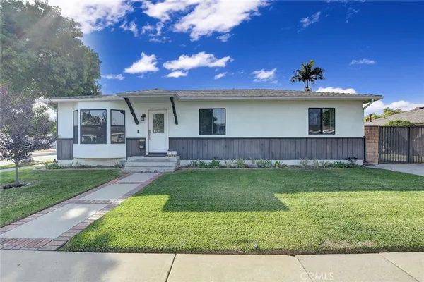 a view of a yard in front of a house with a yard