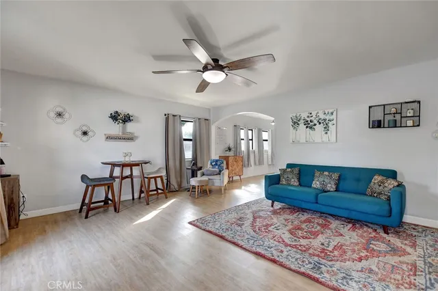 a living room with furniture and a rug