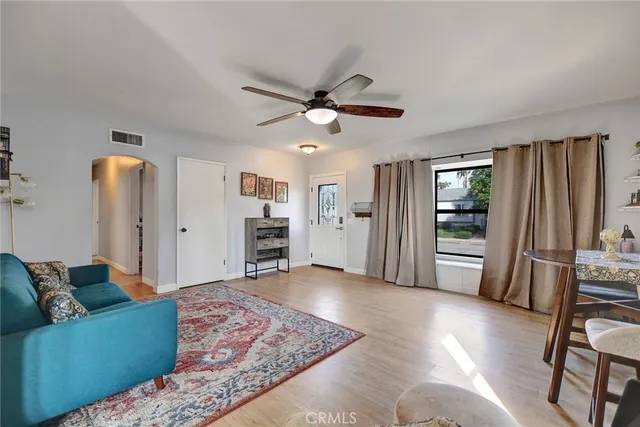 a living room with furniture and a rug