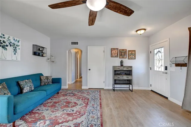 a view of room with furniture and wooden floor