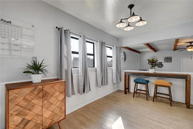 a kitchen with stainless steel appliances a white cabinets stove and refrigerator