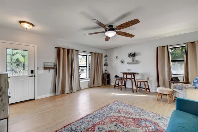 a living room with furniture and a large window