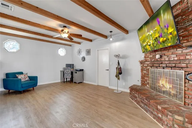 a view of workspace with wooden floor and windows