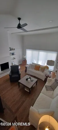 a living room with furniture and a table
