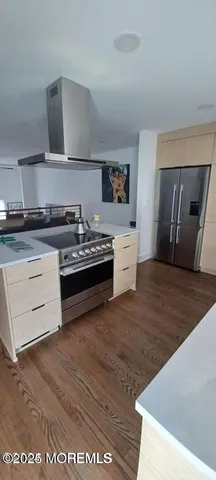 a kitchen with stainless steel appliances granite countertop a stove and a sink