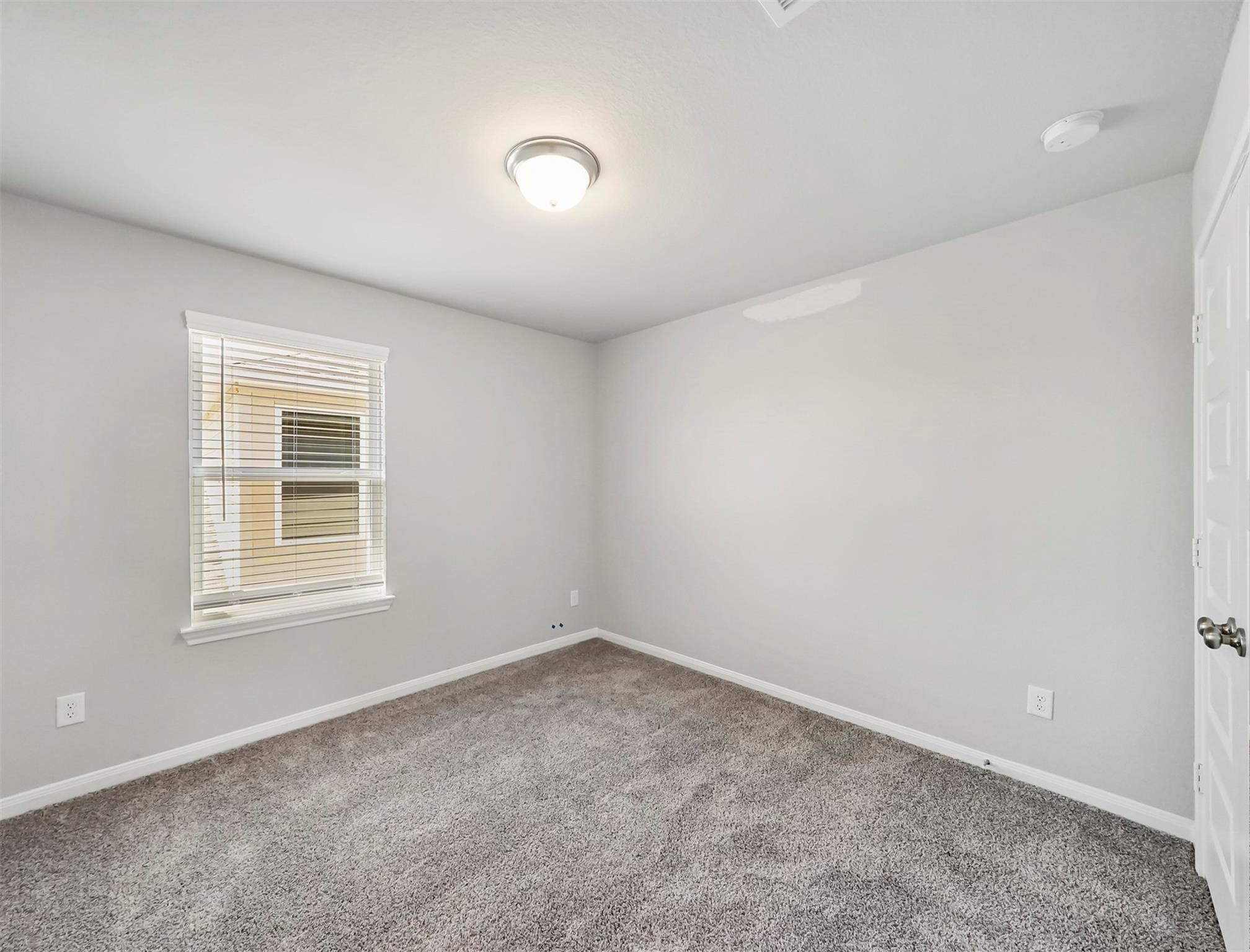 21727 Reserve Ranch Trail Richmond, TX 77407 - Photo 18 of 27 Striking Secondary Bedroom located on the Second Floor features notable amounts of natural lighting from window and plush carpeting.