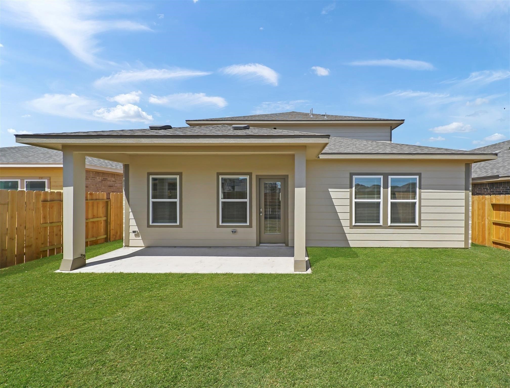 21727 Reserve Ranch Trail Richmond, TX 77407 - Photo 23 of 27 Spacious covered patio offers the perfect space for outdoor dining or relaxing, with a fully fenced backyard for privacy.