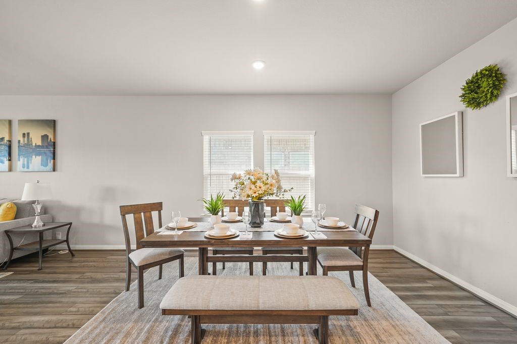 21727 Reserve Ranch Trail Richmond, TX 77407 - Photo 6 of 27 Spacious open-concept dining and living space with fabulous flooring, abundant natural light, and a neutral palette perfect for any decor style. (Virtually Staged)