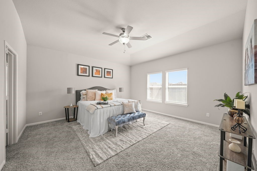 21727 Reserve Ranch Trail Richmond, TX 77407 - Photo 9 of 27 Primary Bedroom: Cozy primary suite with soft tones, plush carpet, and plenty of natural light.