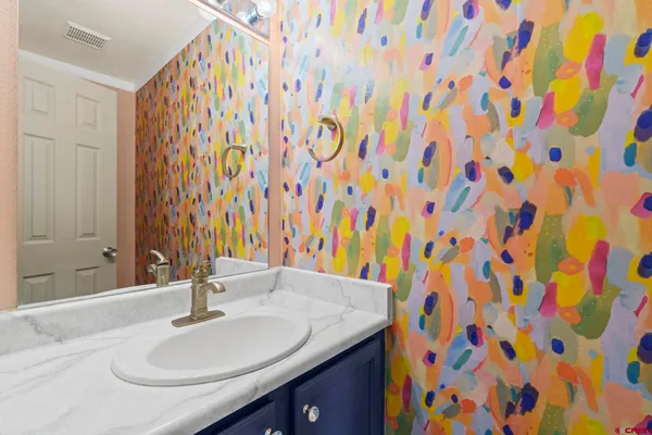 a view of a room with wooden floor and a window