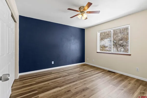 a view of an empty room with a window