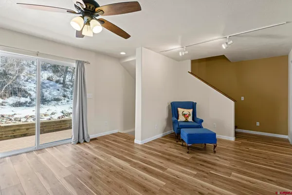 a kitchen with a sink stove top oven and refrigerator