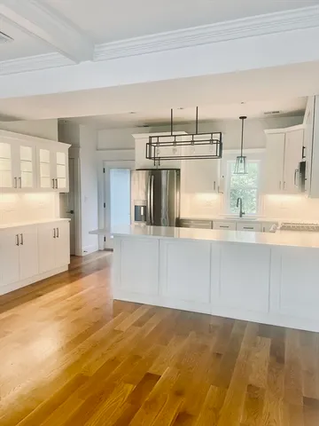 a view of kitchen with wooden floor