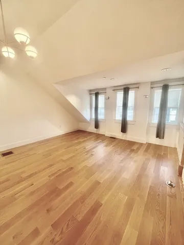 a front view of a house with yard and green space