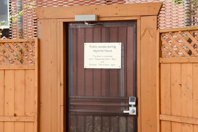 a sign that is on a brick wall