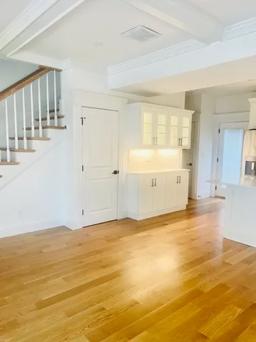 a kitchen with a sink and a refrigerator