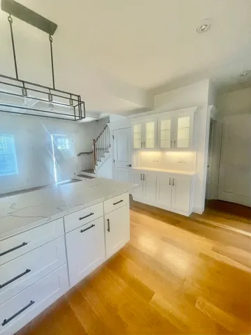 a bathroom with a sink toilet and a mirror