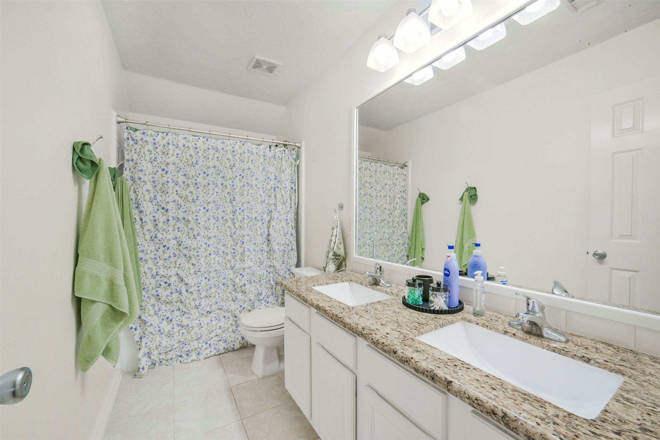38 Tallow Hill Place Spring, TX 77382 - Photo 33 of 50 a bathroom with a granite countertop sink a toilet and a mirror