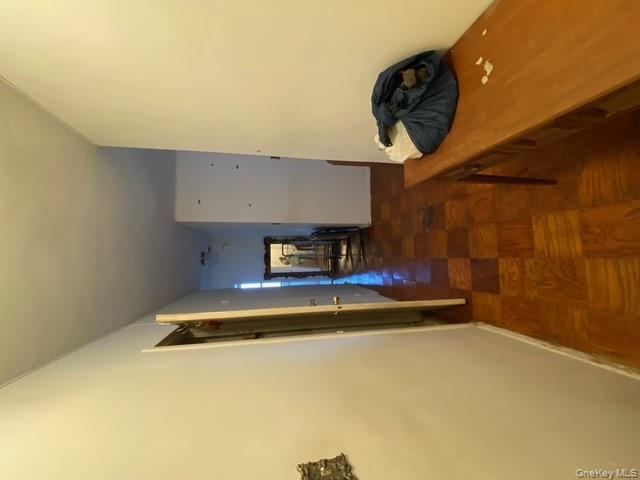 385 Grand Street, Unit L904 Manhattan, NY 10002 - Photo 4 of 6 Corridor featuring baseboards