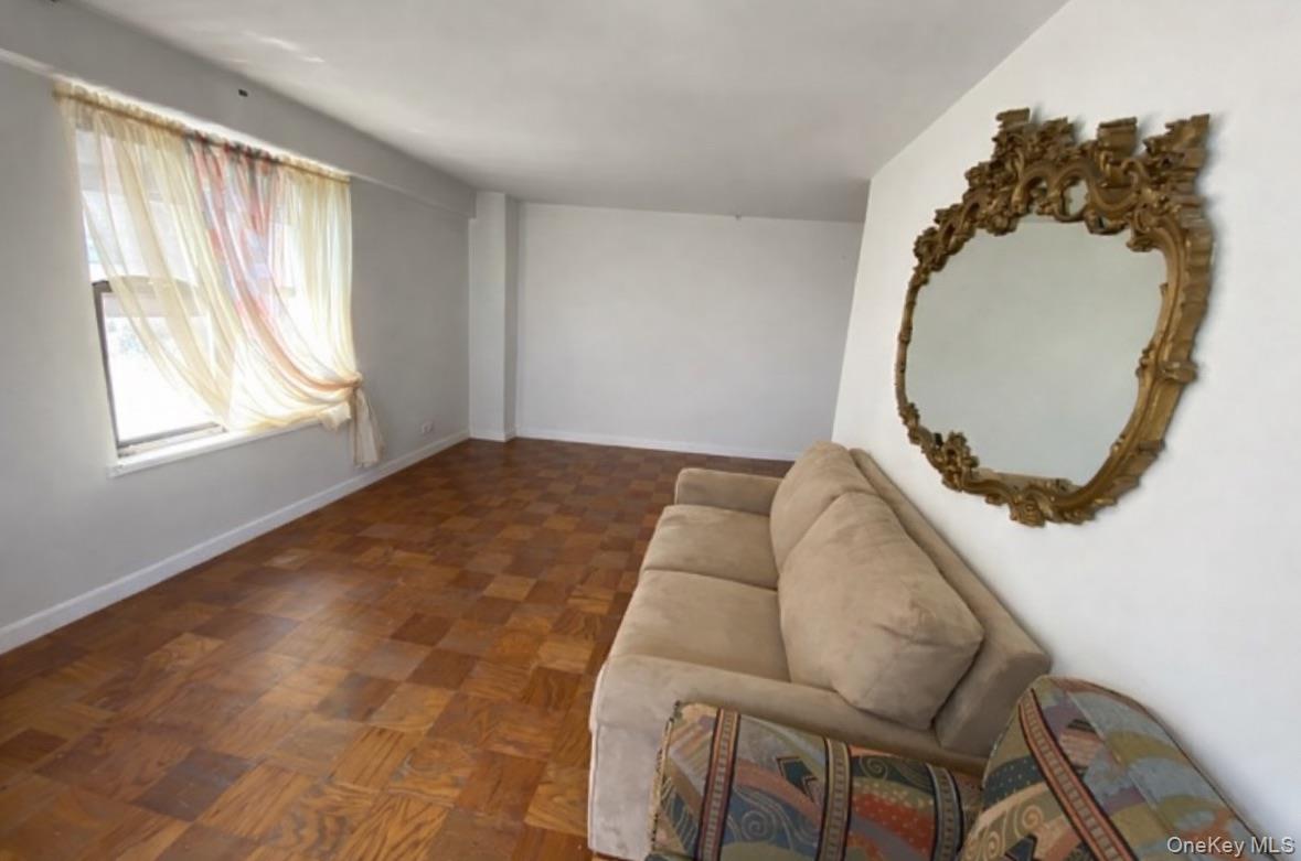 385 Grand Street, Unit L904 Manhattan, NY 10002 - Photo 6 of 6 Sitting room with baseboards