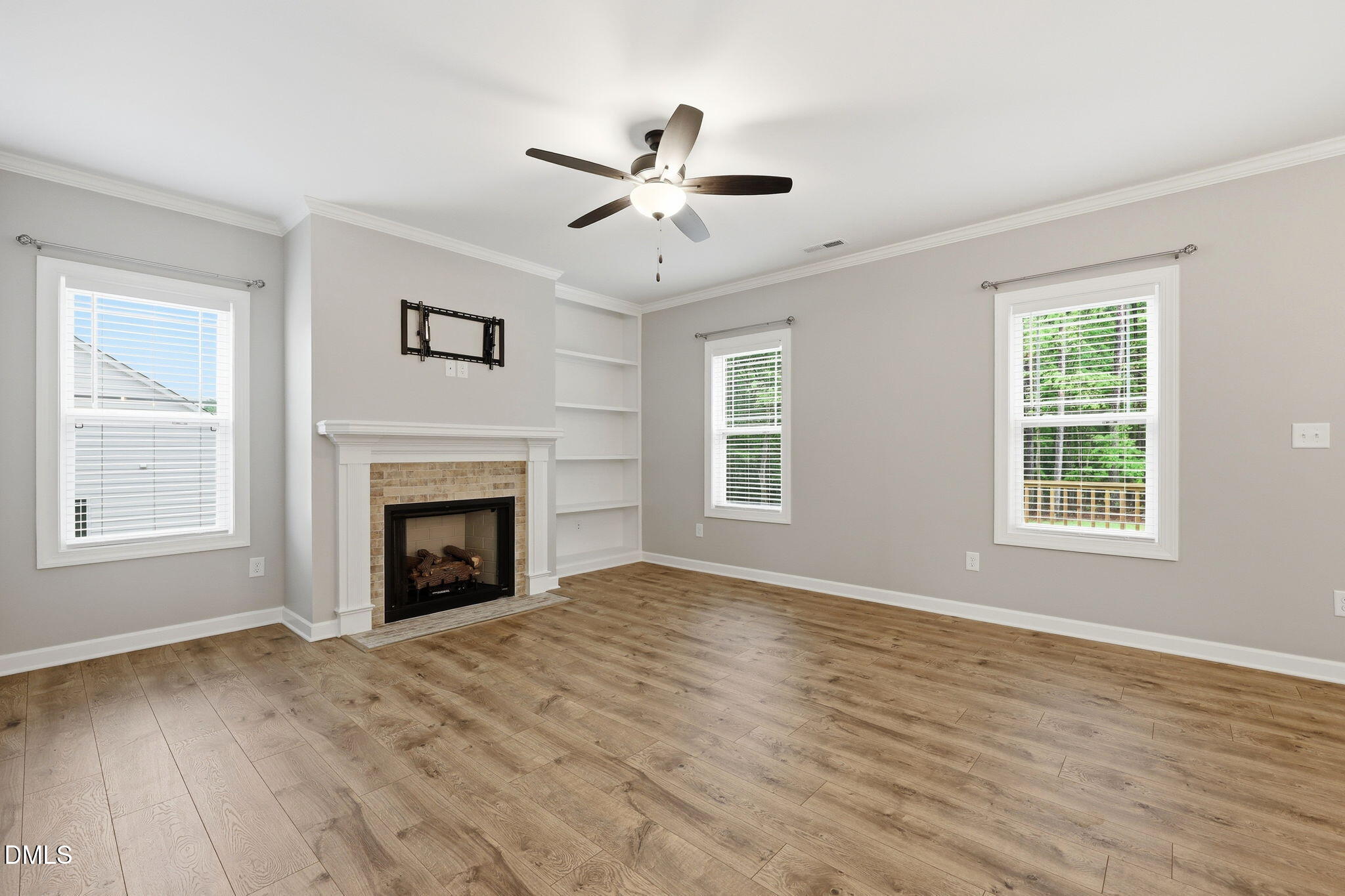 146 Seahawk Way Zebulon, NC 27597 - Photo 11 of 51 a view of empty room with a fireplace and wooden floor