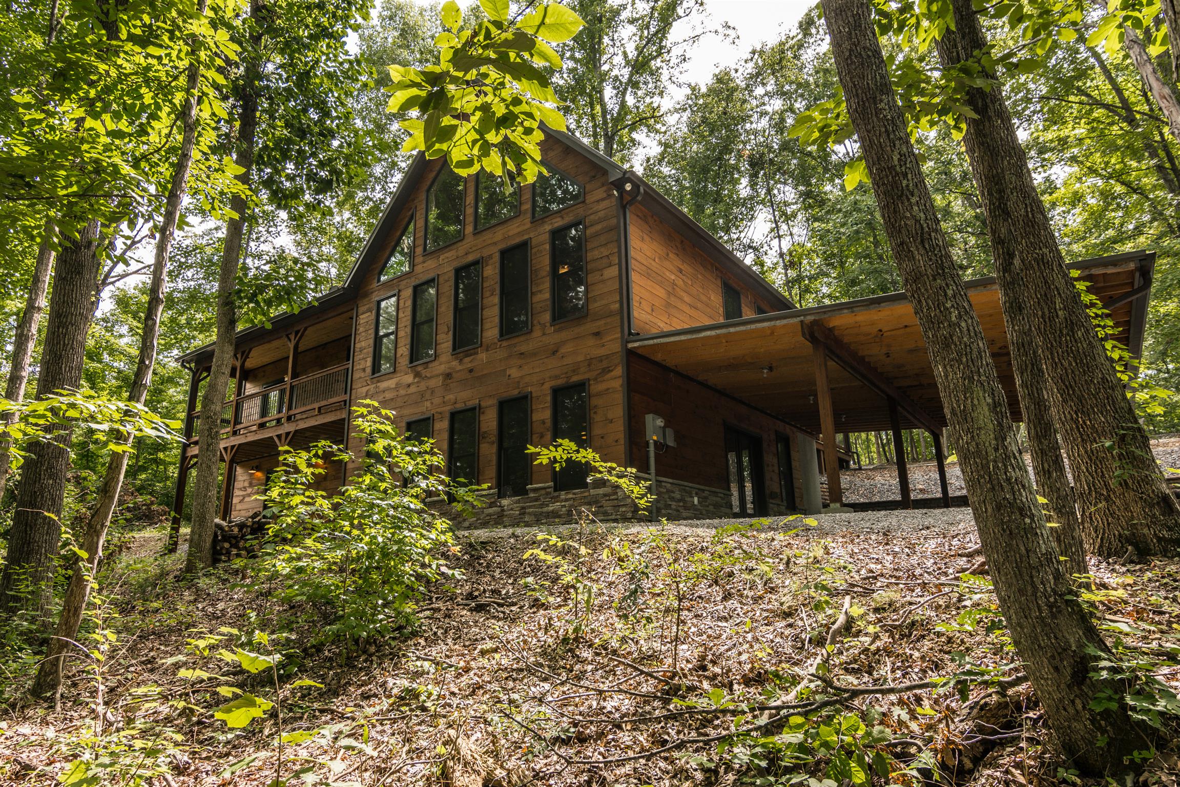 1279 Rogues Fork Road Bethpage, TN 37022 - Photo 1 of 30 a front view of a house with a tree