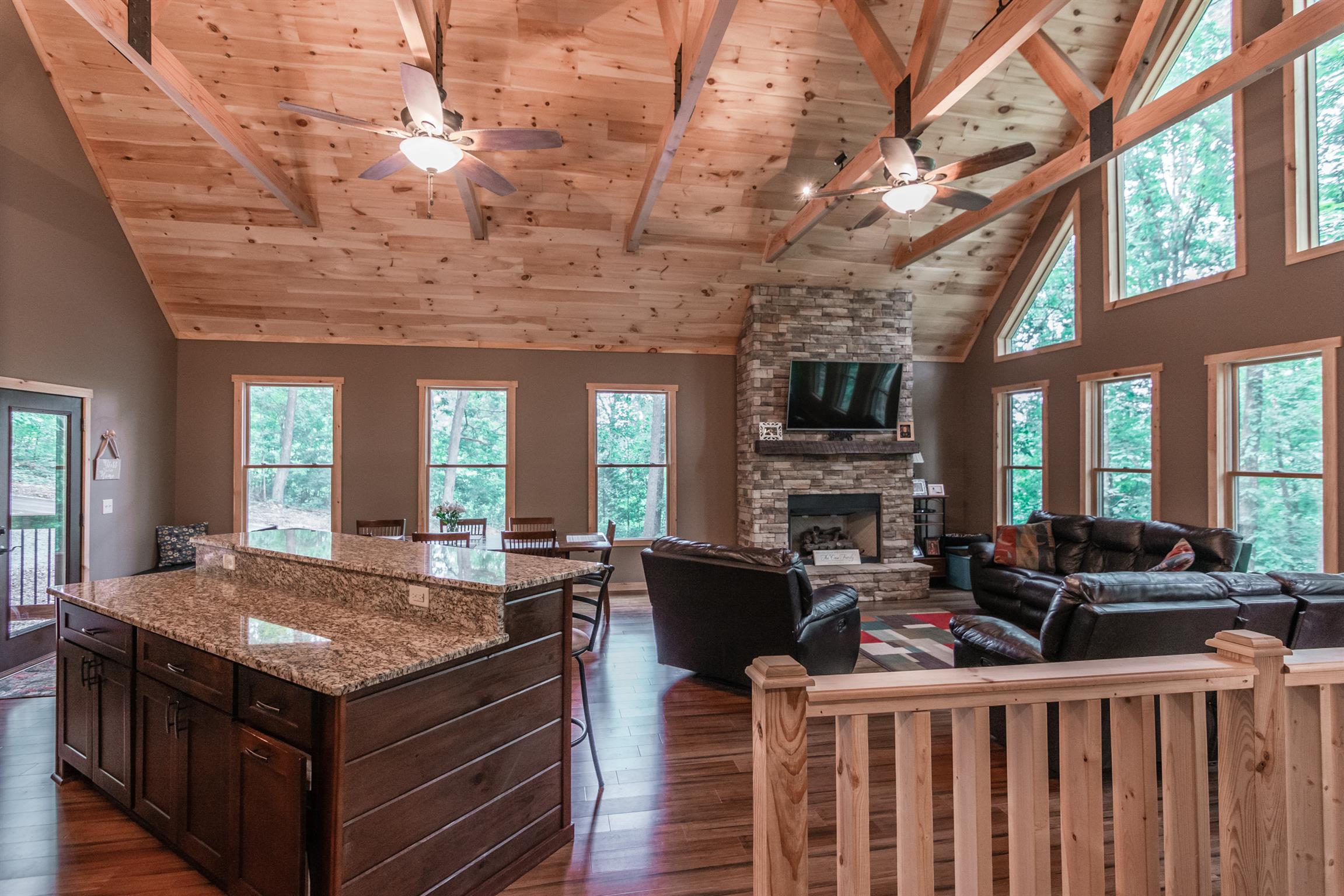 1279 Rogues Fork Road Bethpage, TN 37022 - Photo 19 of 30 a living room with a large window wooden floor and outdoor seating