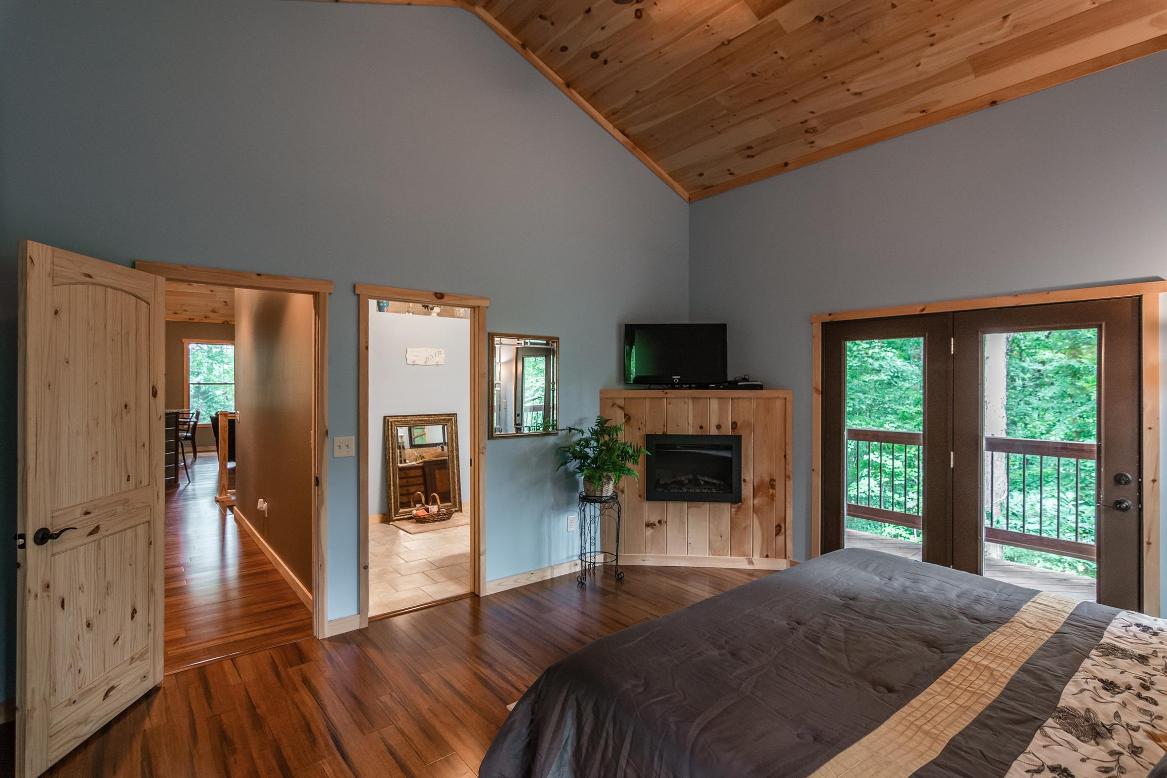 1279 Rogues Fork Road Bethpage, TN 37022 - Photo 21 of 30 a living room with a fireplace furniture and a large window