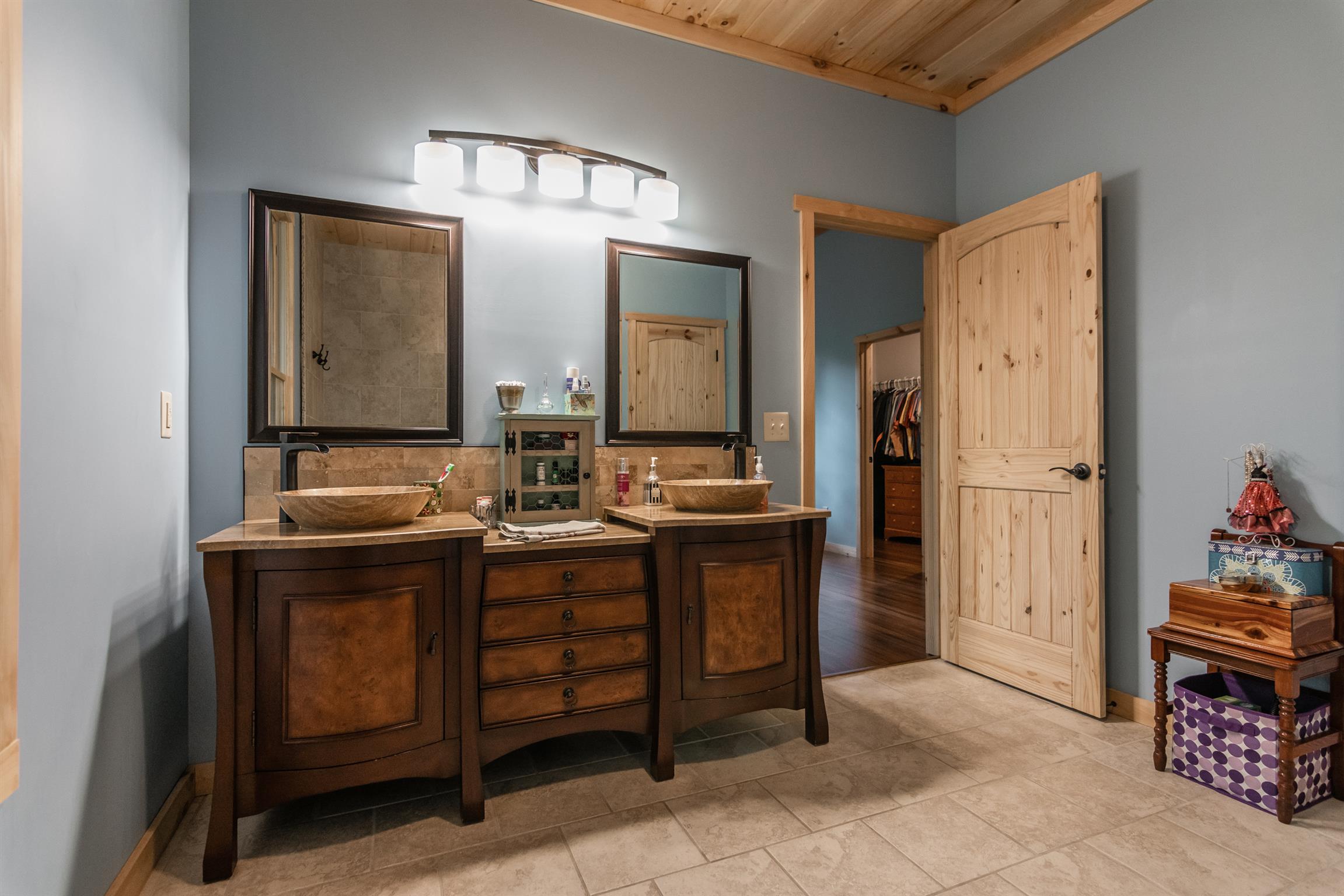1279 Rogues Fork Road Bethpage, TN 37022 - Photo 22 of 30 a bathroom with double vanity sink and a mirror