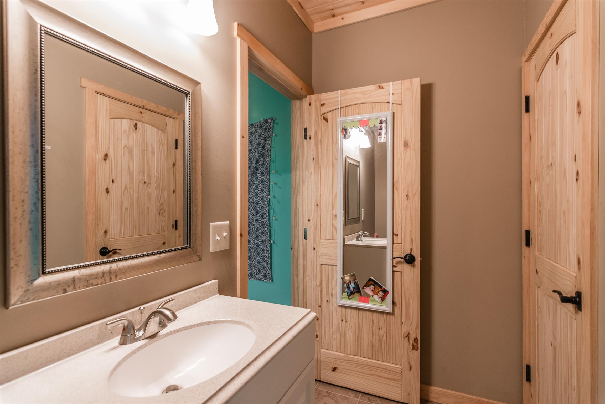 1279 Rogues Fork Road Bethpage, TN 37022 - Photo 28 of 30 a bathroom with a sink and a mirror