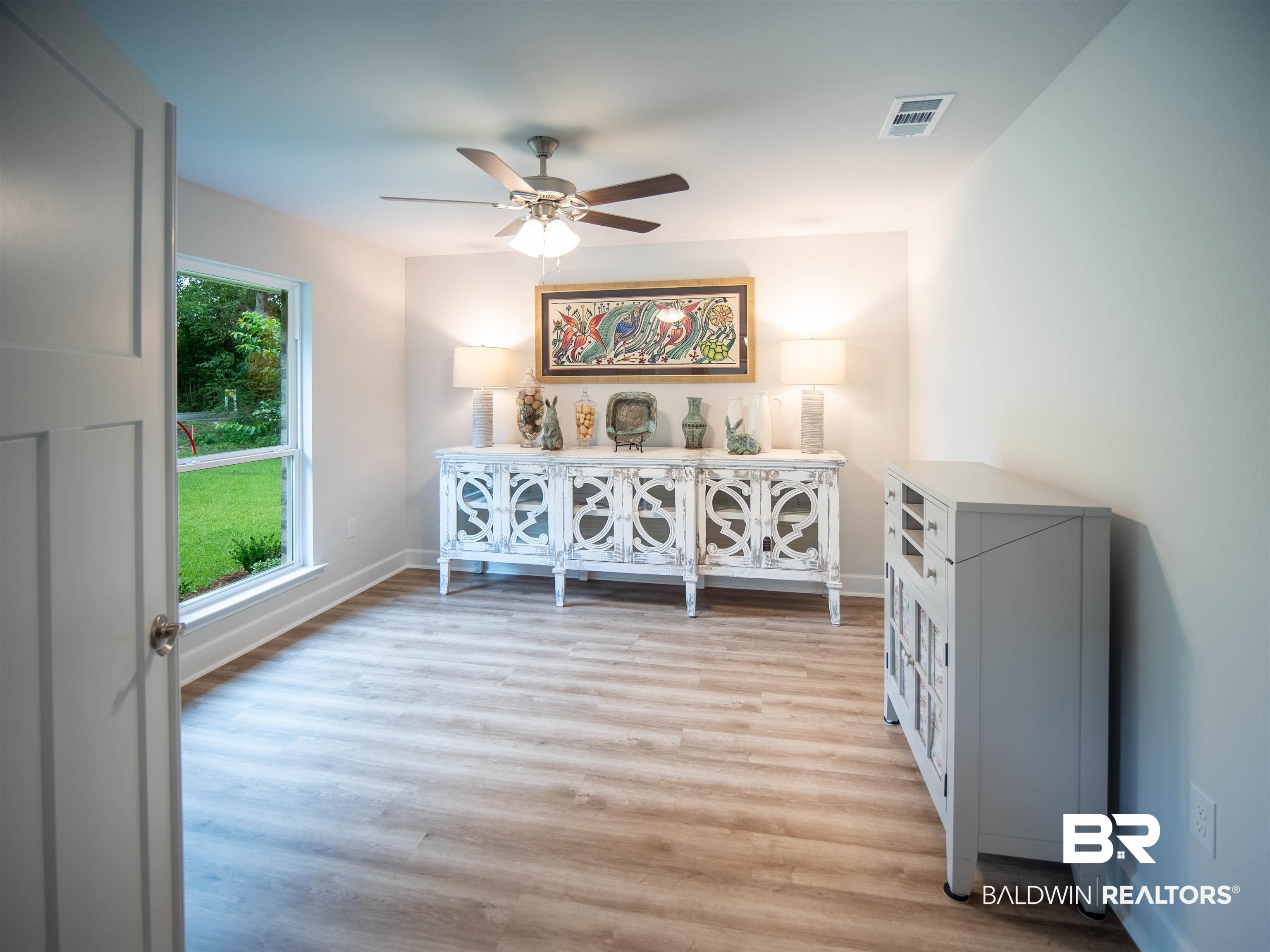 12646 Michigan Avenue Elberta, AL 36530 - Photo 27 of 47 Empty room featuring ceiling fan and light wood-type flooring