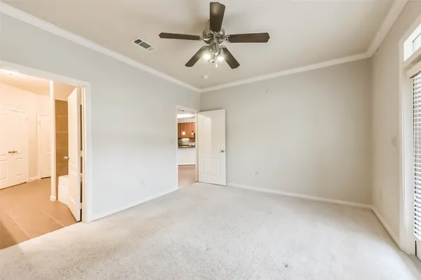 a view of a livingroom with a ceiling fan and window