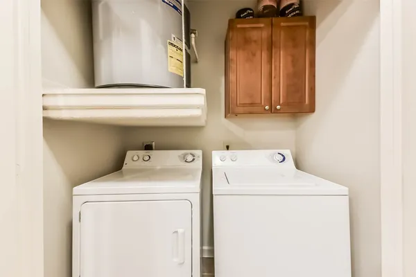 a utility room with dryer and washer