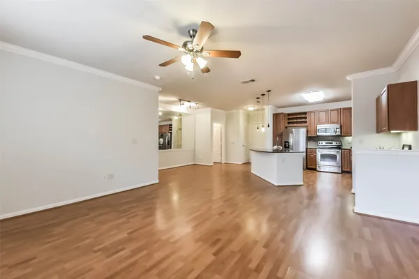 a view of kitchen with cabinets and wooden floor