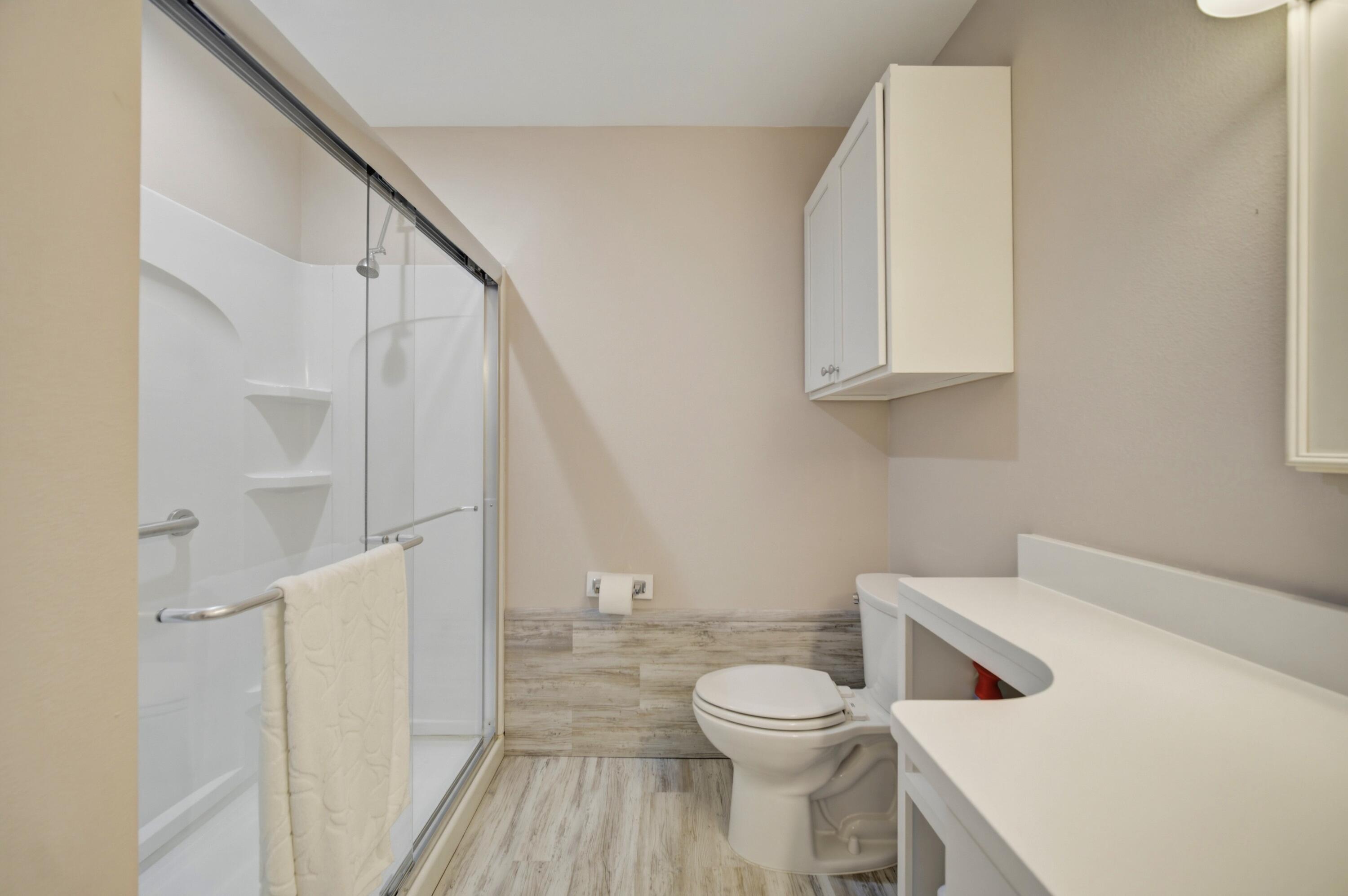 261 Wilkerson Road DeFuniak Springs, FL 32433 - Photo 59 of 76 a white toilet sitting next to a bathroom sink