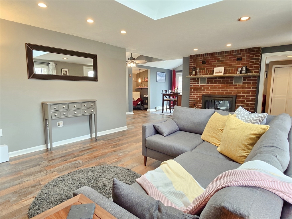 33 Pine Hill Road Ashland, MA 01721 - Photo 11 of 40 a living room with furniture and a fireplace