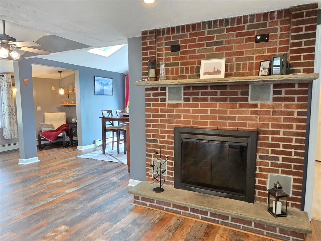 33 Pine Hill Road Ashland, MA 01721 - Photo 14 of 40 a living room with furniture and a fireplace