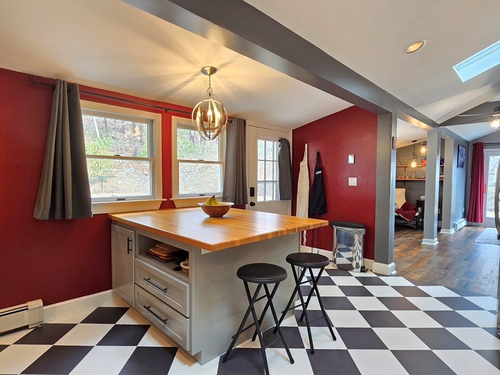 33 Pine Hill Road Ashland, MA 01721 - Photo 27 of 40 a view of a dining hall with a dining table and chairs
