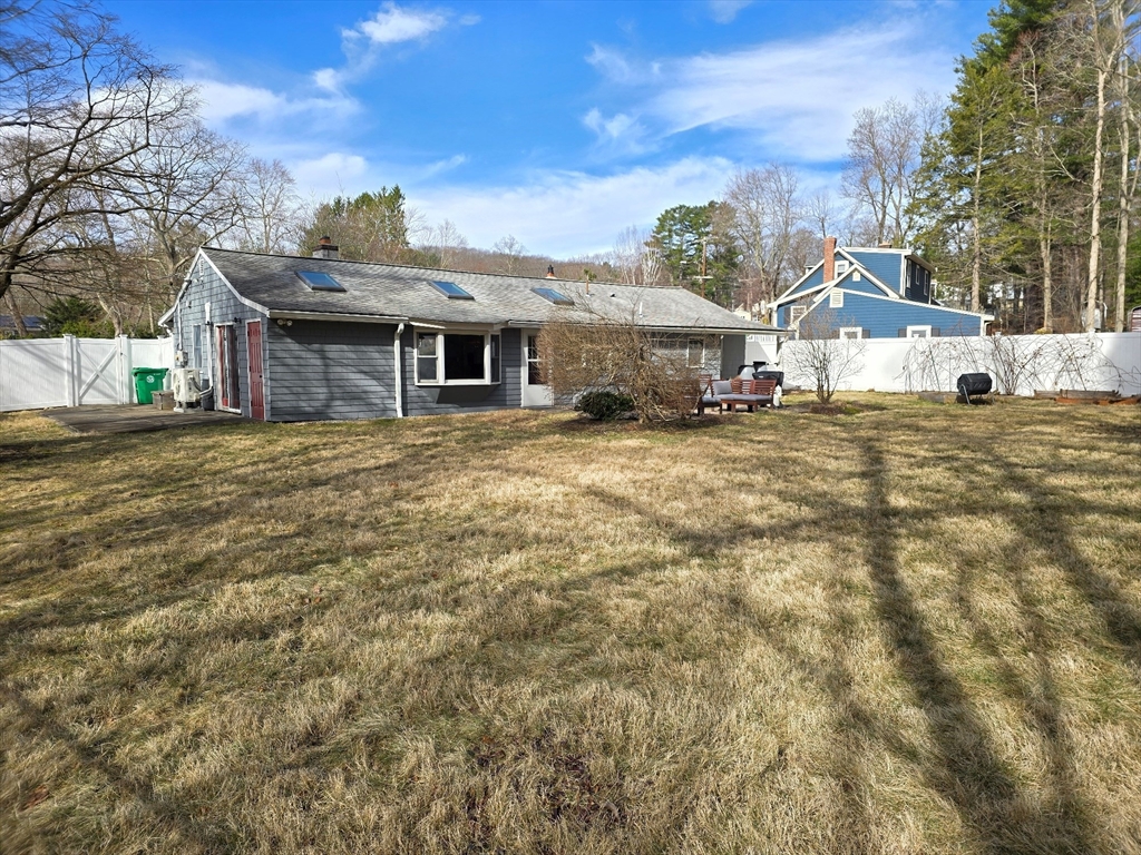 33 Pine Hill Road Ashland, MA 01721 - Photo 39 of 40 a front view of a house with a yard and garage