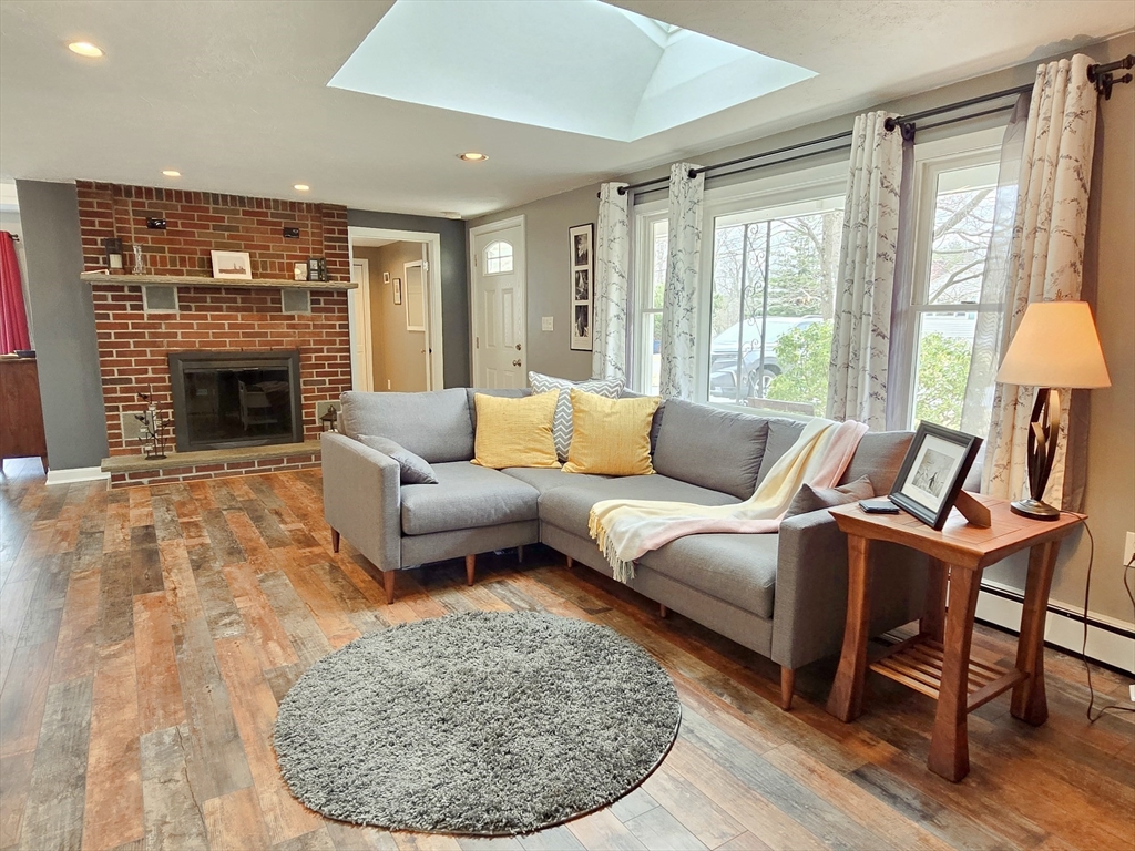 33 Pine Hill Road Ashland, MA 01721 - Photo 10 of 40 a living room with furniture and a fireplace