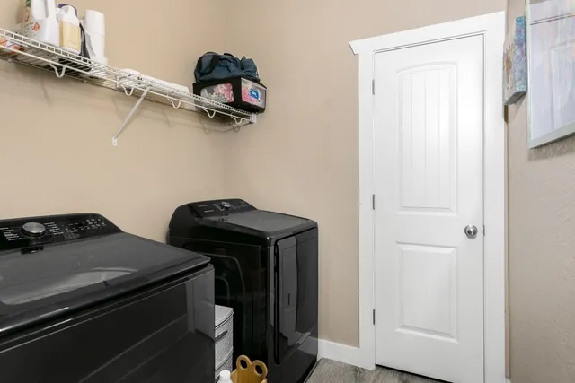a view of a storage and utility room with racks on the wall