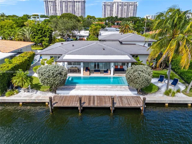 a view of a house with pool yard and a patio