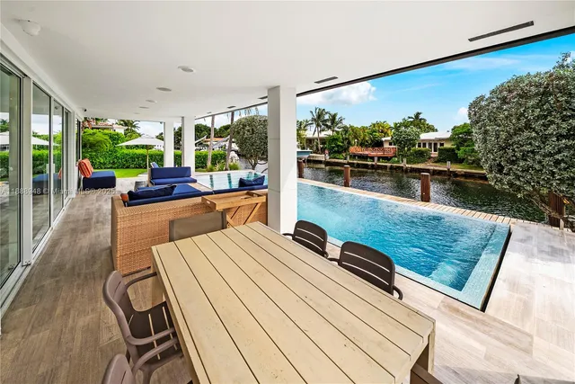 a kitchen with stainless steel appliances a sink stove and refrigerator